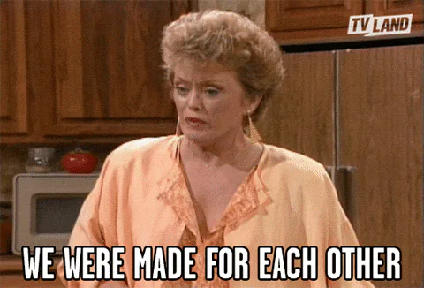 A woman with short blond curls in a peach robe says, 'We were made for each other.'
