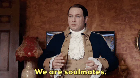 A man in a colonial military coat speaks earnestly, captioned 'We are soulmates.'