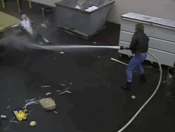 Apps 2026 c6 A worker tumbles into a large rolling bin while another worker watches.
