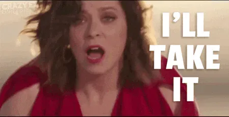 ill-take-it.gif A woman with curly hair in a red top throws her arms wide as text reads 'I'll take it.'