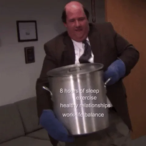 A man struggles to carry a large pot labeled with life priorities, then spills it all on the floor.