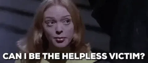 2e91093b-a274-f660-f03e-87b8f54ac312.gif A woman with tousled blond hair asks sarcastically, 'Can I be the helpless victim?'