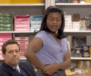 58d7f530-3087-a1d2-ee52-a9e9c9dfafb2.gif A woman reacts with wide eyes and a smile in a store aisle, saying 'Oh my God! I love it.'