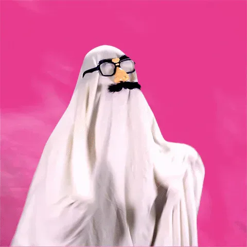 Dance+Dancing+GIF+by+Headexplodie.gif A person in a white ghost sheet wearing joke glasses with a fake nose and mustache dances against a hot pink background.