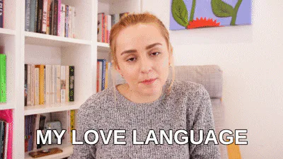 A woman on a couch says 'My love language is talking about the love languages.'