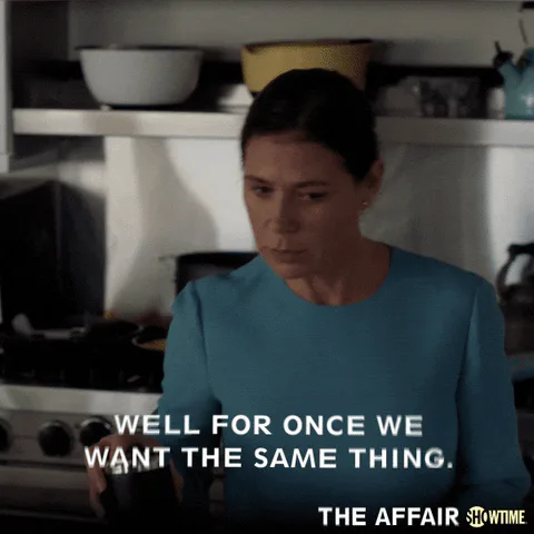 A woman in a teal top in a kitchen says, 'Well for once we want the same thing.'