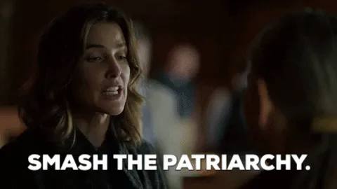 A woman in a courtroom speaks firmly and says 'Smash the patriarchy.'