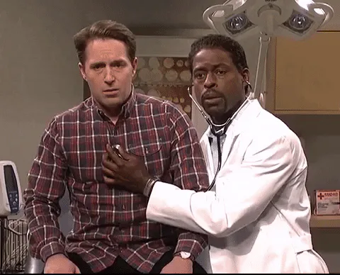 Two men in a doctor's office; one embraces the other as text reads 'You've been hurt before.'