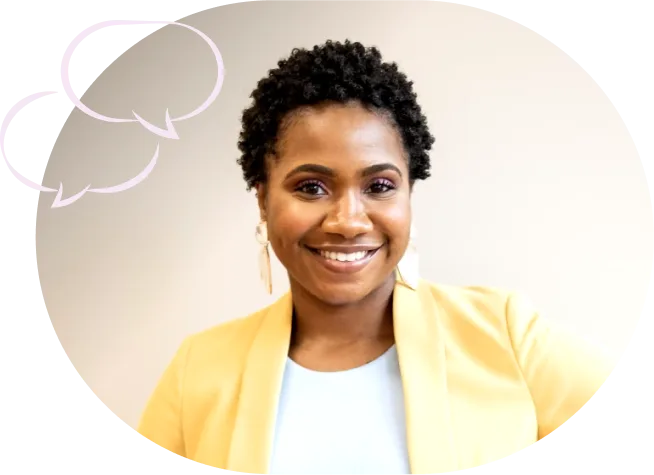 Image-9.png A smiling woman with short curly hair wears a yellow blazer, with pale pink speech-bubble graphics beside her.