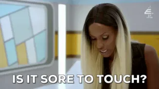 Sexual+Health+GIF+by+E4.gif A woman with long blonde hair asks 'Is it sore to touch?'