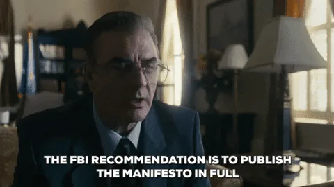A man in a suit speaks sternly, saying 'The FBI recommendation is to publish the manifesto in full.'