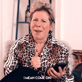 Comedy+Love+GIF+by+Bross+Bagels.gif A woman in a leopard print top holds a phone and gestures, captioned 'I mean come on! Where's your commitment?!'