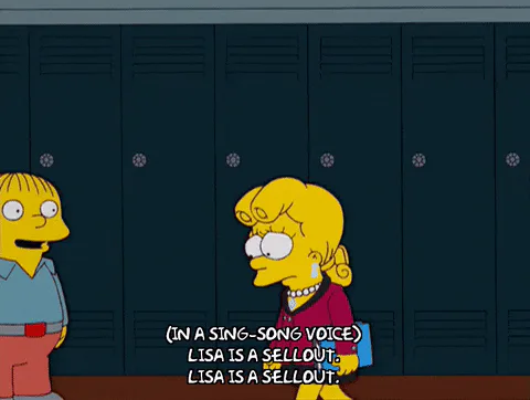 Two cartoon schoolkids by lockers, one chanting in a sing-song voice, 'Lisa is a sellout, Lisa is a sellout.'