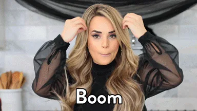 A woman with wavy blond hair gestures excitedly then smiles, captioned 'Boom, science.'