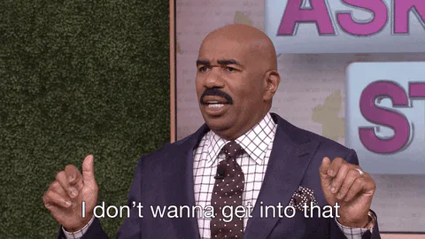 A man in a suit raises his hands and says 'I don't wanna get into that.'