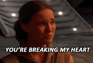 A young woman with her hair pulled back cries and says 'You're breaking my heart.'