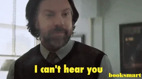 Speak+Up+GIF+by+Booksmart.gif A bearded man in a sweater vest says 'I can't hear you,' labeled 'booksmart.'