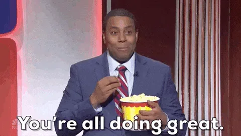 Kenan+Thompson+Popcorn+GIF+by+Saturday+Night+Live.gif A man in a suit eats popcorn and says 'You're all doing great.'