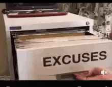 Hands flip through a file drawer of folders labeled 'Excuses.'