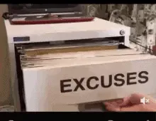 6315bfa7-92f2-0def-0d70-5f590e4e724b.gif Hands flip through a file drawer of folders labeled 'Excuses.'
