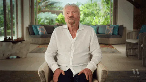 A white haired man sits in a chair by a garden window and says 'You just gotta differentiate yourself.'