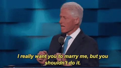 A man speaks at a podium, captioned 'I really want you to marry me, but you shouldn't do it.'