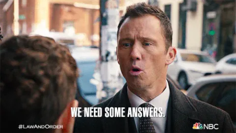 Answer+Me+Episode+8+GIF+by+Law+&+Order.gif A man in a suit on a city street says 'We need some answers.'
