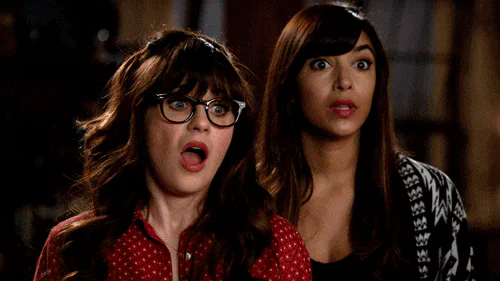 Two women react with wide, shocked expressions before their faces relax into a calmer look.