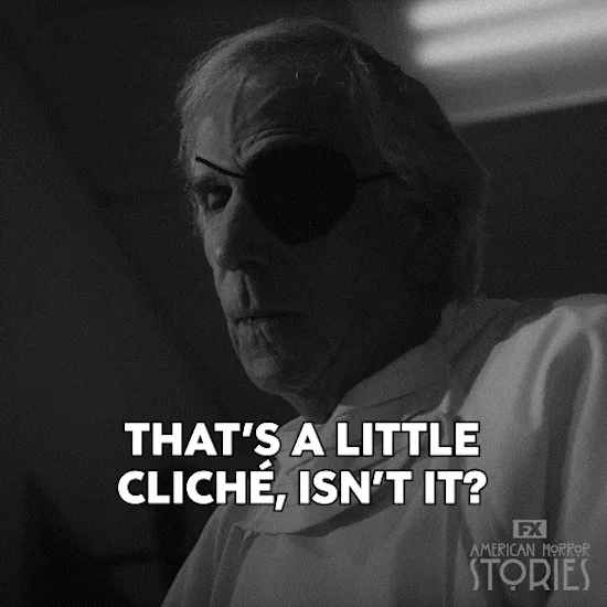 An older man with an eye patch looks off in black and white, captioned 'That's a little cliche, isn't it?'
