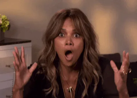 No+Way+Reaction+GIF+by+The+Tonight+Show+Starring+Jimmy+Fallon.gif A woman with wavy hair raises both hands in shock, mouth open in surprise.