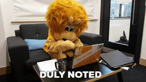 d297ccf4-3857-0169-15e4-bed6a049edbb.gif A plush lion mascot sits at a laptop labeled 'I'm on loan' as text reads 'Duly noted.'