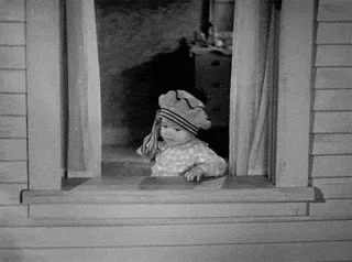 Throw+Away+Make+It+Rain+GIF.gif A black-and-white film shows a toddler at a window as paper money flutters past.