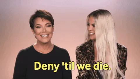 2d6d9ad8-2453-b574-280b-bddcaabc085e.gif Two women smile at the camera as one says 'Deny 'til we die.'