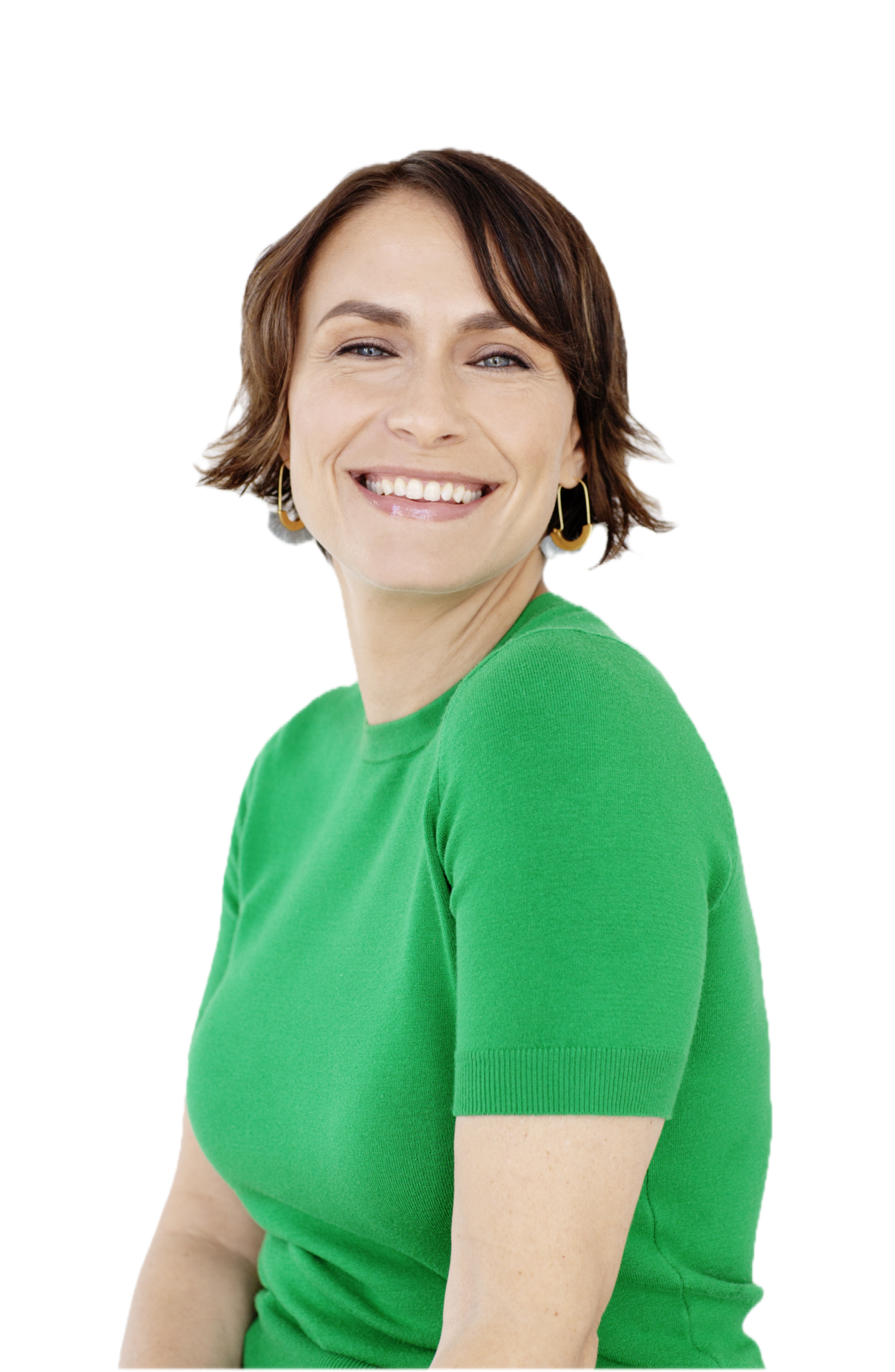 Person smiling, wearing a green shirt and hoop earrings against a white background.