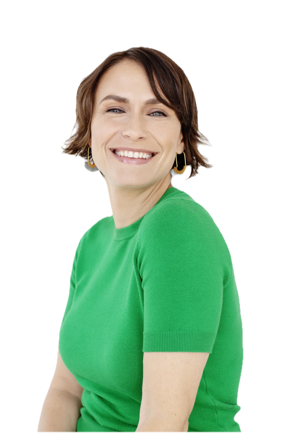 Person smiling, wearing a green shirt and hoop earrings against a white background.