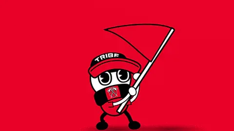 Lets+Go+Flag+GIF+by+Tribe+Gaming.gif A cartoon mascot in a cap labeled TRIBE waves a large flag energetically.