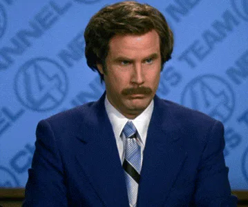 A man in a blue suit says 'I don't believe you' before lighting a cigarette.