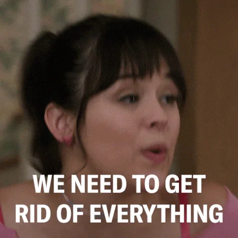 A young woman with bangs speaks emphatically as on-screen text reads 'We need to get rid of everything.'