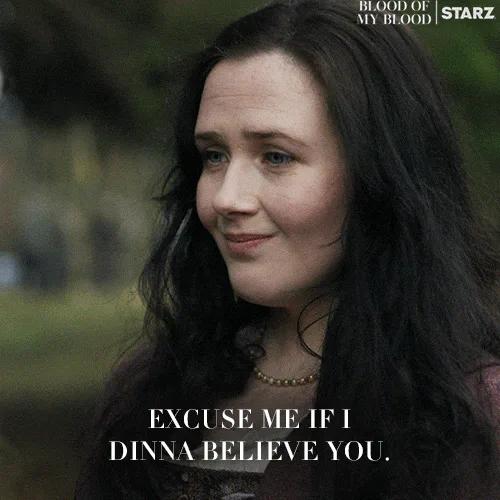 A woman looks skeptical as on-screen text reads 'Excuse me if I dinna believe you.'