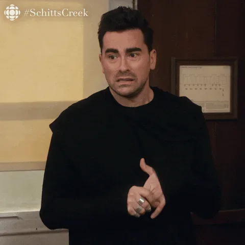 a3947113-01ef-6f54-04e4-0e470490ca98.gif A man in a black sweater gestures with his hands and asks 'I'm sorry?'