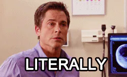 A man in a purple shirt in an office looks around with a puzzled expression as the caption reads 'Literally.'