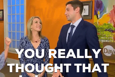 Two TV hosts in formal wear laugh and dance as text reads 'You really thought that.'