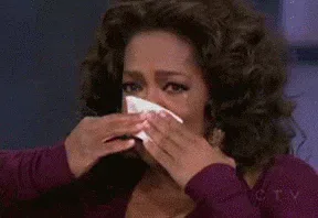Break+Up+Crying+GIF+(1).gif A woman wipes tears from her eyes with a tissue while crying.
