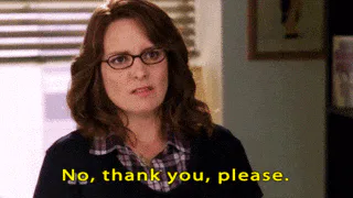 A woman in glasses and a cardigan says 'No, thank you, please' with a flat expression.