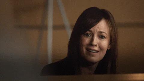A woman with reddish hair looks tearful as on-screen text reads 'I'm doing my best.'