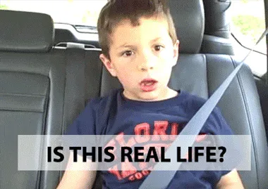 confused+real+life+GIF.gif A young boy sits in a car back seat with a seatbelt across his chest and asks 'Is this real life?'