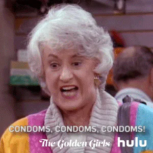 An older woman gestures and shouts 'Condoms, condoms, condoms!'