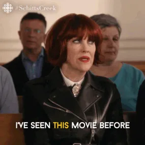 Looks+Familiar+Schitts+Creek+GIF+by+CBC.gif A woman with a red bob and leather jacket looks around as on-screen text reads 'I've seen this movie before.'
