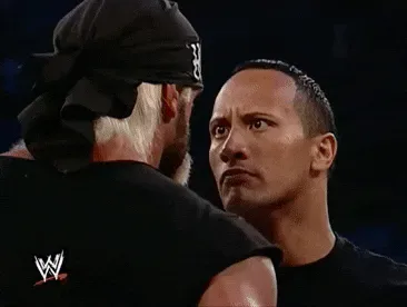 Staring+The+Rock+GIF+by+WWE.gif Two men in a wrestling ring exchange a tense, unblinking stare.