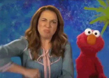 sesame+street+elmo+GIF.gif A woman gestures excitedly beside a red puppet character as text reads 'Brainstorm!'